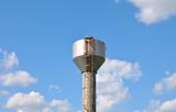 Water tower over blue sky