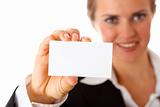 smiling modern business woman holding blank business card
