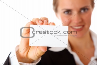 smiling modern business woman holding blank business card
