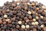 Heap of black and white pepper