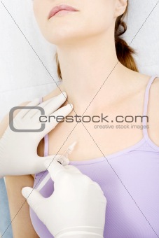 woman receiving an injection from a doctor