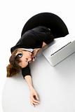 tired young businesswoman with laptop on white background studio