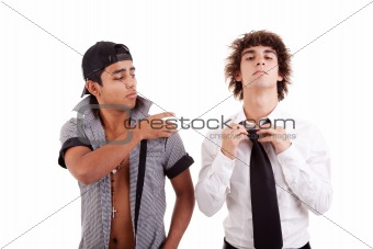 young latin men, gesturing  with a finger - removing something from the shoulder (a white boy), isolated on white, studio shot