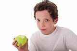 boy eating a green apple