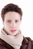 portrait of a serious young man, with winter clothes, on white background. Studio shot