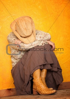 Western woman with her head down