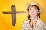 Woman in front of Wooden Cross