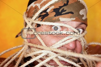 Man wrapped in ropes