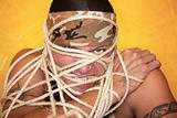 Man wrapped in ropes