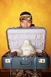 Man with Buddha in suitcase