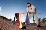 Native American man with colorful flags