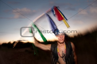 Indigenous man with ceremonial pole