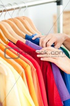 Close-up of a female hispanic customer looking for clothes
