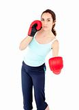 Sporty hispanic woman with boxing gloves working out