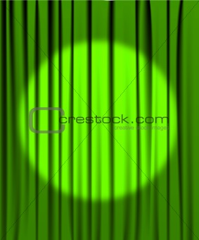 Green curtain with a spotlight