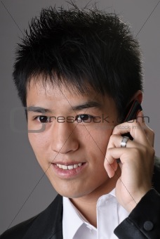 Asian business man using cellphone