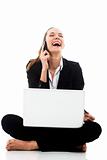 businesswoman with laptop on the floor on white background studio
