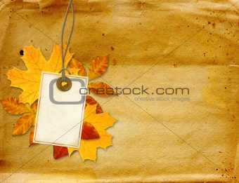 Label and autumn leaves