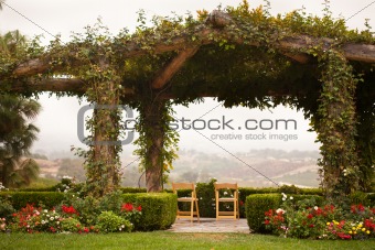 Beautiful Vine Covered Patio and Chairs with Country View.