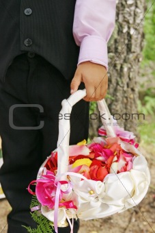 Wedding, basket of petals and boy
