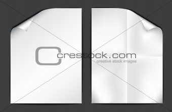 Two sheets of white paper on dark background