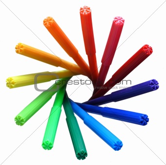 Rainbow circle of felt pens on white