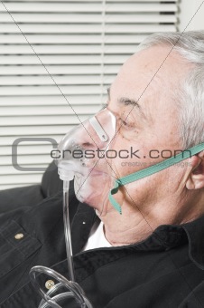 senior with oxygen mask