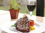 Rib Eye Steak served with wine