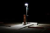 Parking lot pay station at night