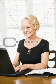 Mature woman with laptop.