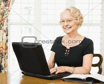 Mature woman with laptop.