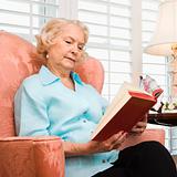 Mature woman reading.