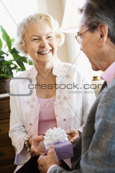 Mature couple with present.