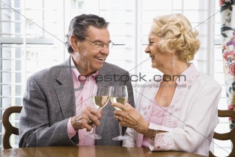Mature couple toasting.