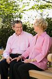 Mature couple on bench.