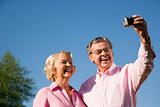Mature couple taking picture.
