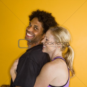 Woman hugging man.