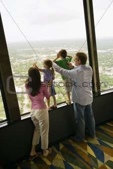 Family at window.