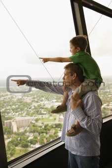 Father and son pointing.
