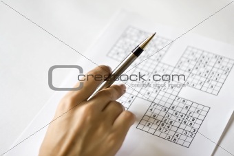 A hand on sudoku grid