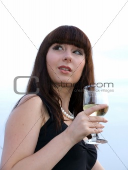 The girl with a glass of white wine