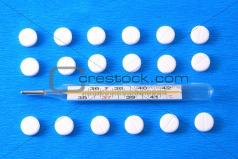 Pills and thermometer