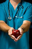 Doctor offering apple