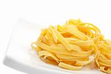 Uncooked pasta nest on a dish