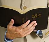 Man HOlding Bible