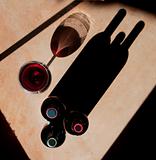 Wine Bottles and Wine Glass with Dramatic Shadow