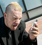 Frustrated Punk Businessman on his Cell Phone