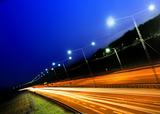 cars at night with motion blur.