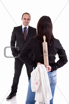 woman waiting for her husband, with the rolling pin and a white shirt with lipstick mark hidden behind his back