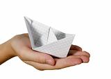Child is ship made from paper
